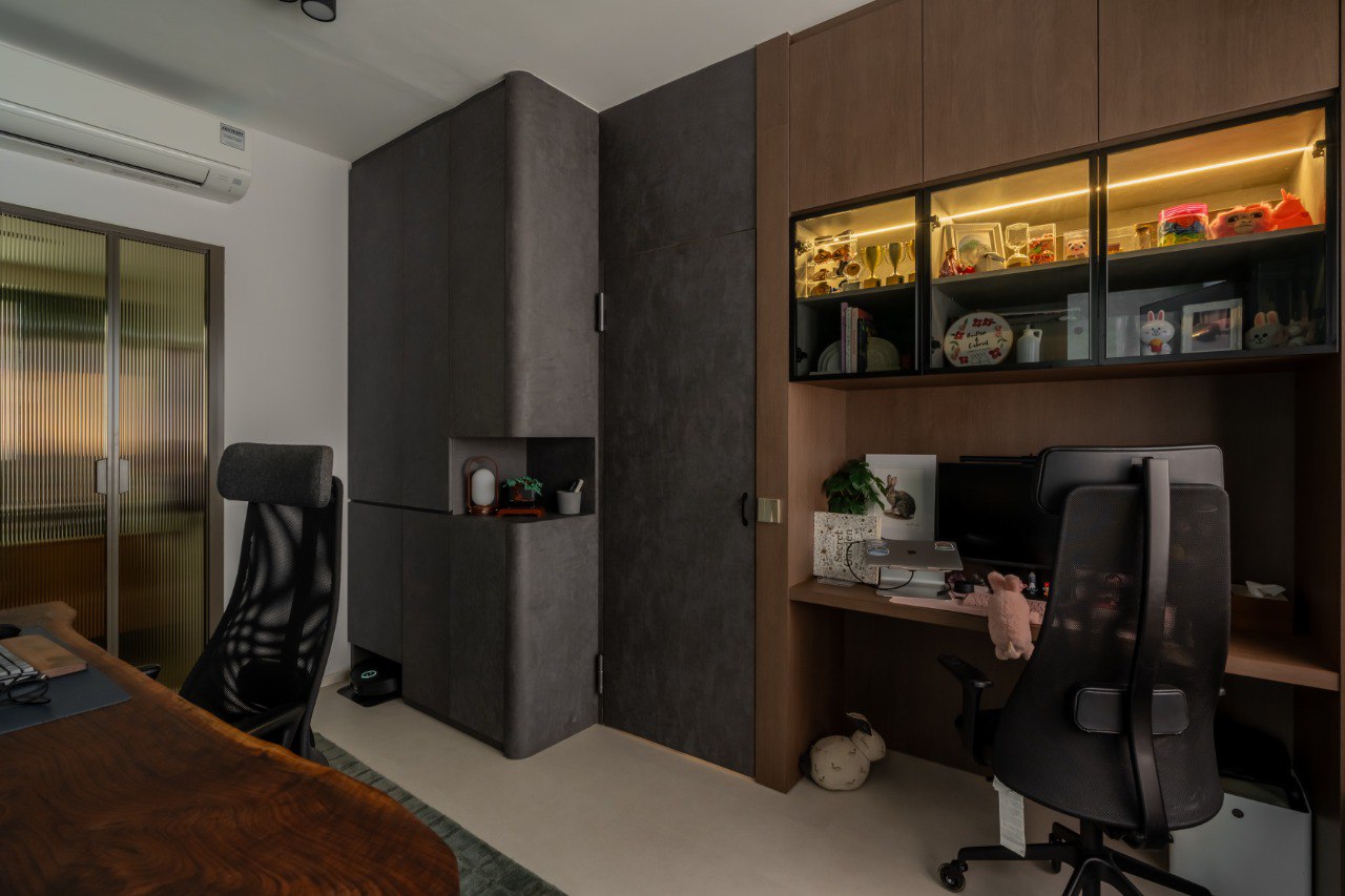 A Green Thread — timber-lined workspace with illuminated display shelving